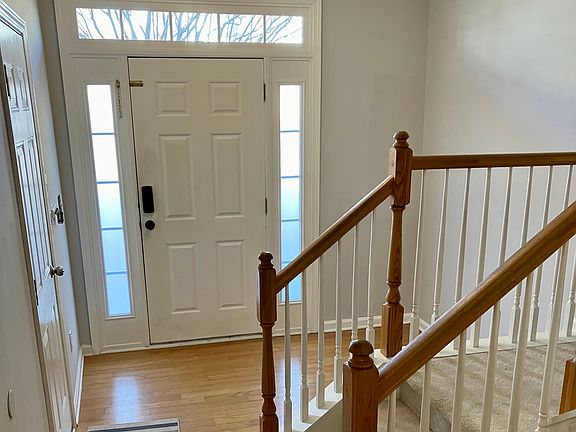 Front door and garage door of entry