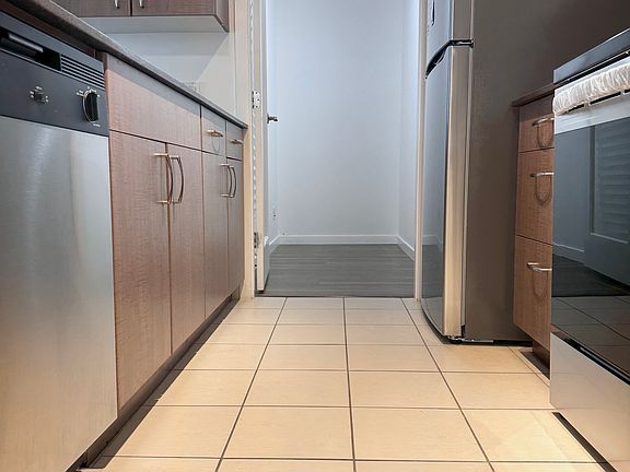 Kitchen (8'11 x 8'9) + Pantry / Storage Area (9' x 4', enclosed - can be used as den)