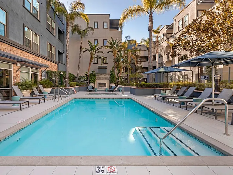 Swimming pool and spa with lounge seating
