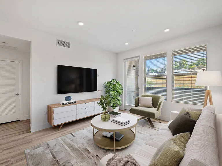 Large windows and open concept floor plans create an inviting space.