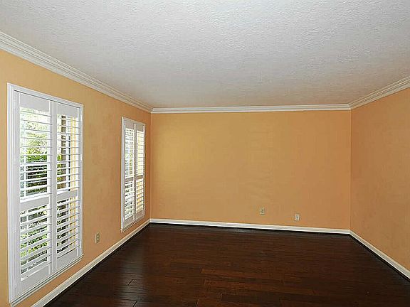 Large bright study boasts plantation shutters!