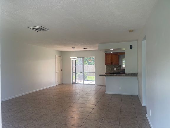 Open living room and dinning area off kitchen.
