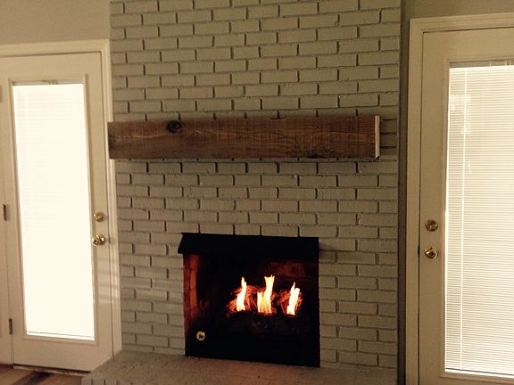 Gas logs and cedar mantle