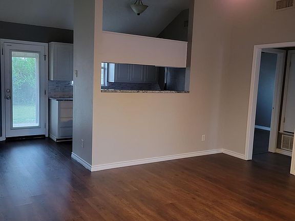 Different view of walking in from the front door. Doorway is to guest rooms and bathroom.