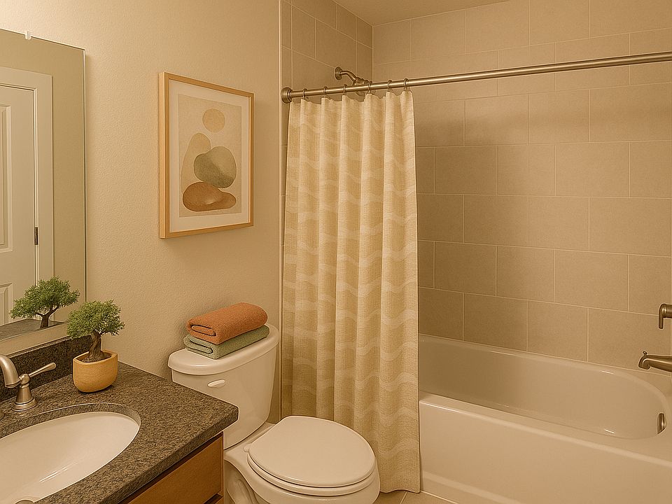 The bathroom has everything you need with a tiled bath and shower, counter with space to get ready for or end your day, and additional storage right outside with a linen closet.