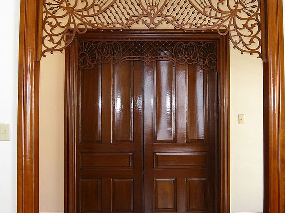 Fret work over pocket doors