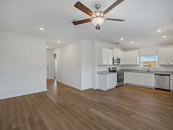 Enjoy luxury vinyl flooring in the main living areas