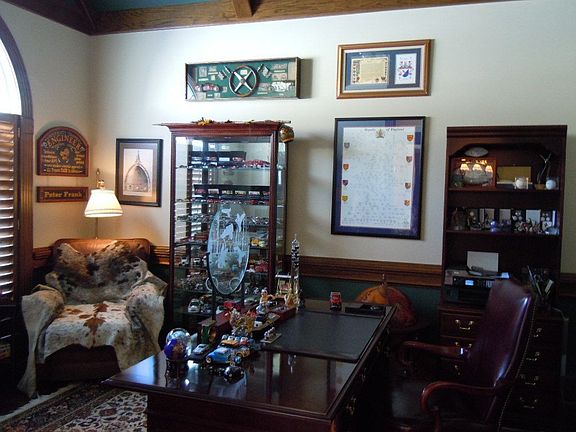 Office with vaulted ceiling & plantation shutters