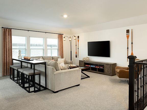 Game night, move night, or homework time, this upstairs gathering area is perfect for all