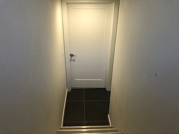 Actual ADU door (utility room with washer/dryer to the right)