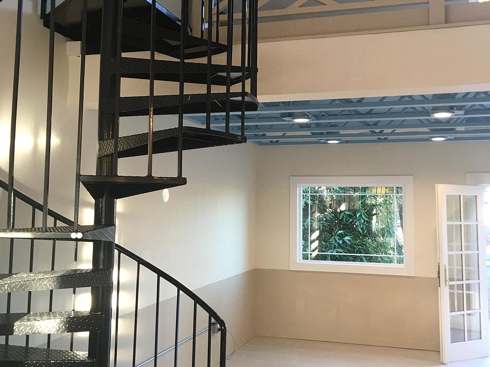 Spiral stairway to upper bedroom.