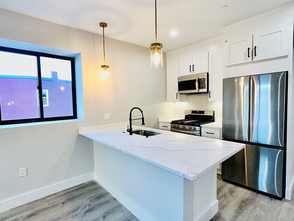 Quartz Countertops and Stainless Steel Appliances! 
Layouts differ but finishes are exact. 
Photo may be from a different unit