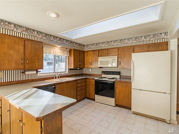 Functional, bright kitchen with large skylight.
