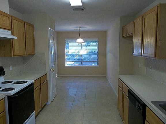 View of kitchen and breakfast area from the formal dining.