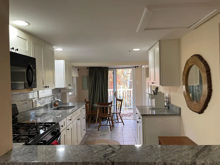 Eat-in Kitchen with lots of granite countertops to whip up a fabulous meal