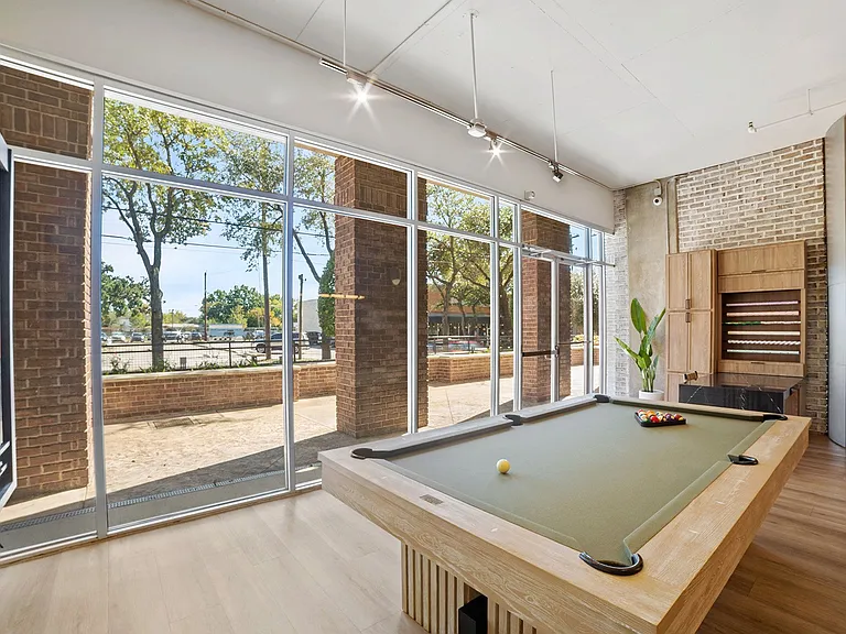 Billiards table and gift wrap station in clubhouse