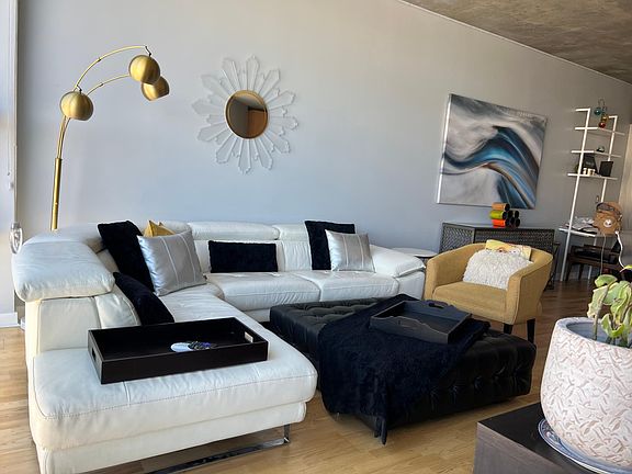 Large real leather sectional with pop up rest for total relaxation.