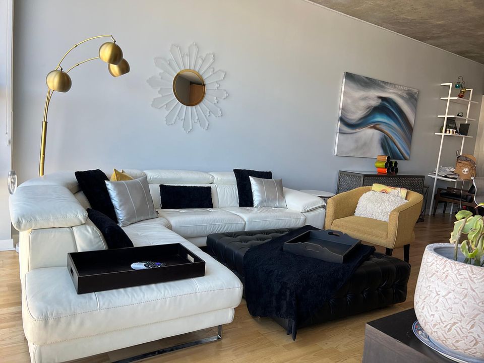 Large real leather sectional with pop up rest for total relaxation.