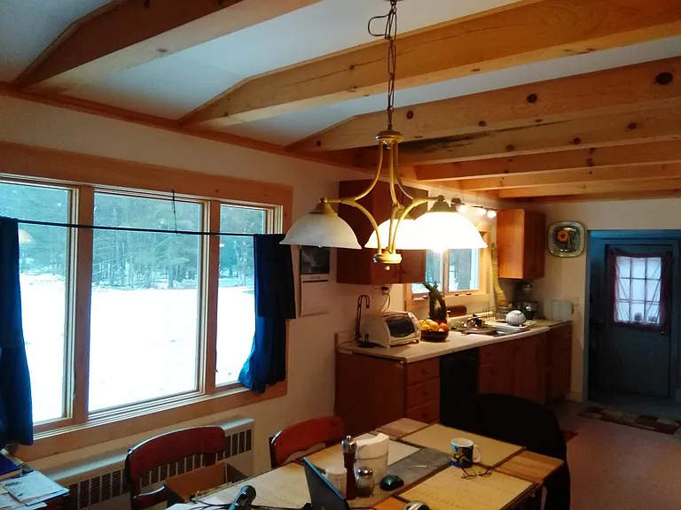 Warm beamed Ceilings throughout Kitchen dining and living room.