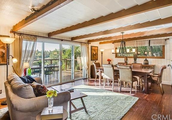 Another view of the living room with large dining area beyond.