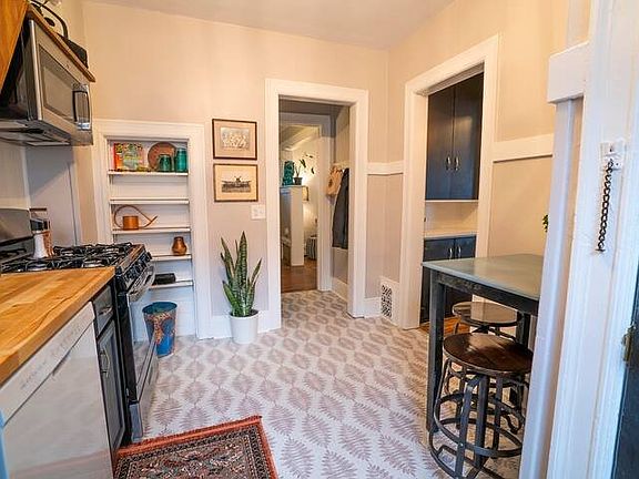 Newly remodeled kitchen with Cafe table on the left-hand side of the picture. All new appliances, fully stocked with dishes, flatware, Keurig coffee maker, and more!