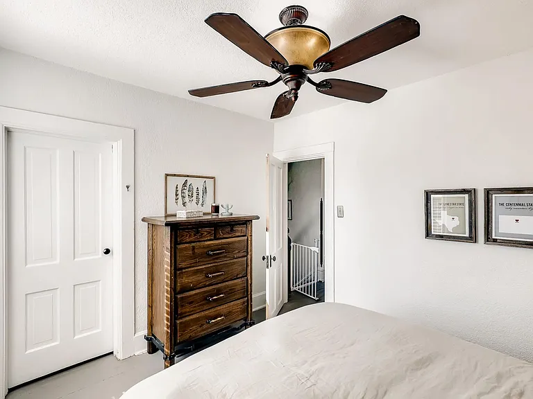 Primary bedroom features king size bed
