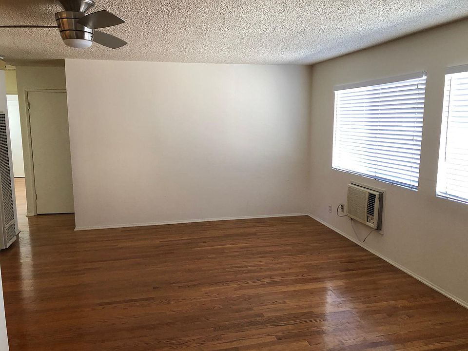 spacious living/dining room with hardwood flooring