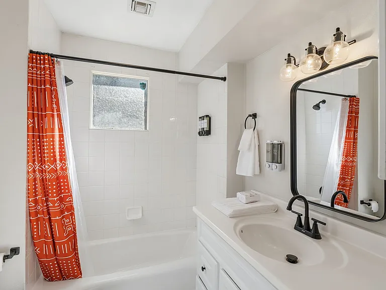 Tub and shower. Starter toiletries and towels included.