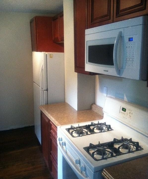 Brand New Kitchen with Stove and Refrigerator