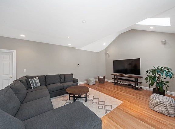 Large 1st Floor Family Room with vaulted ceilings, skylight!