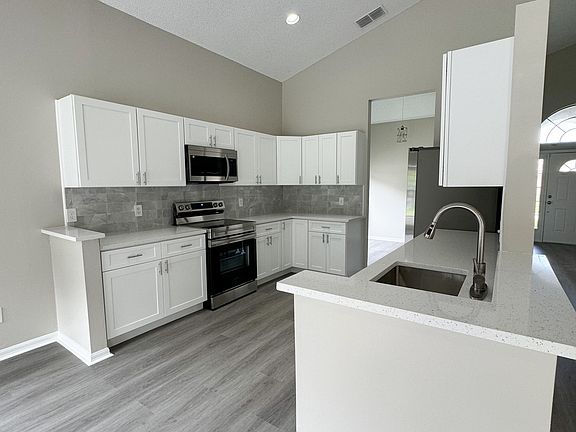Brand new cabinets and appliances in kitchen