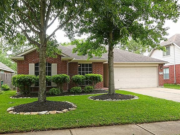 This lovely home has a 2/car attached garage, stone border flower beds and a sprinkler system.