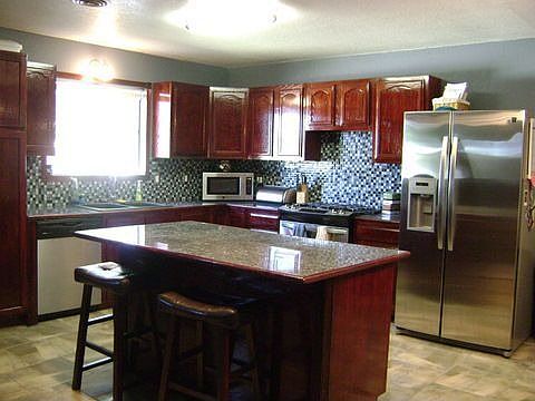 Tiled kitchen with Classic Wood Cabinets