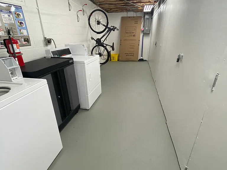 Shared laundry area with washer & dryer for the other 1 br & 2 br units in the triplex. Great bike storage for added convenience.
