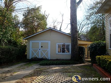 Left side of house-driveway to Garage/Shop