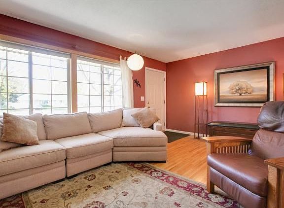 Another view of the spacious and inviting living room and entry.