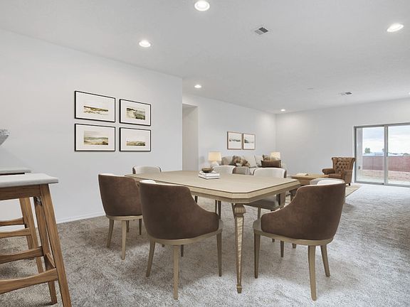 Just off the gathering room is a quaint dining space and breakfast bar.