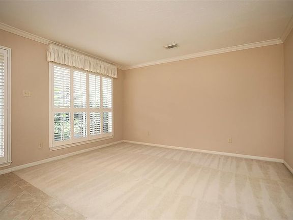 Here's another view of this large room. Take note of the crown molding here... this home has good bones!