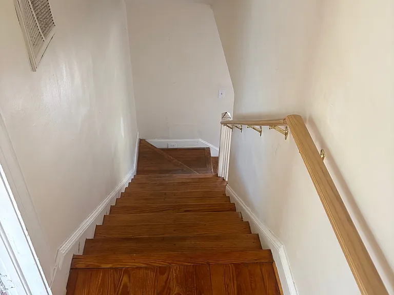 Stairs to upstairs bedrooms and baths