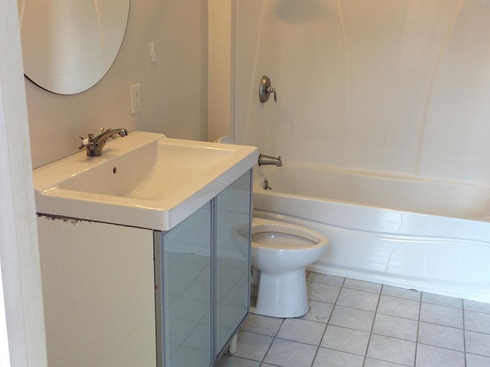Modern bathroom with in unit washer and dryer