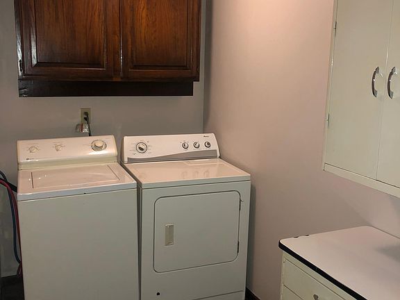 Laundry room off kitchen with washer and dryer for tenant's use