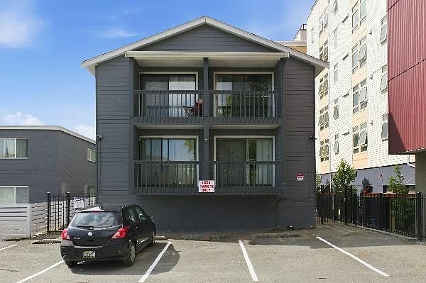 Rear of building with off street assigned parking