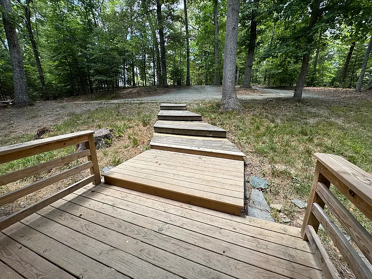 Leaving the front door, looking at parking area and driveway