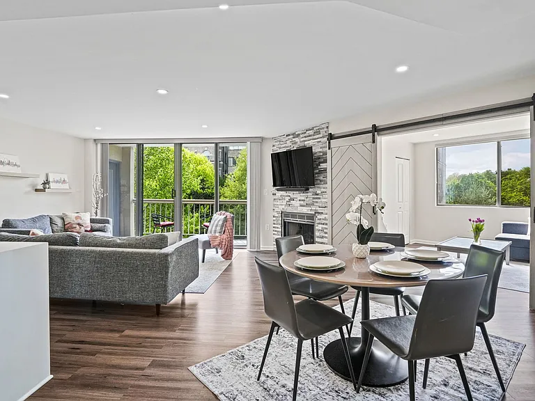Perfect for hosting_an inviting dining area that transitions effortlessly into the living room with beautiful neighborhood views