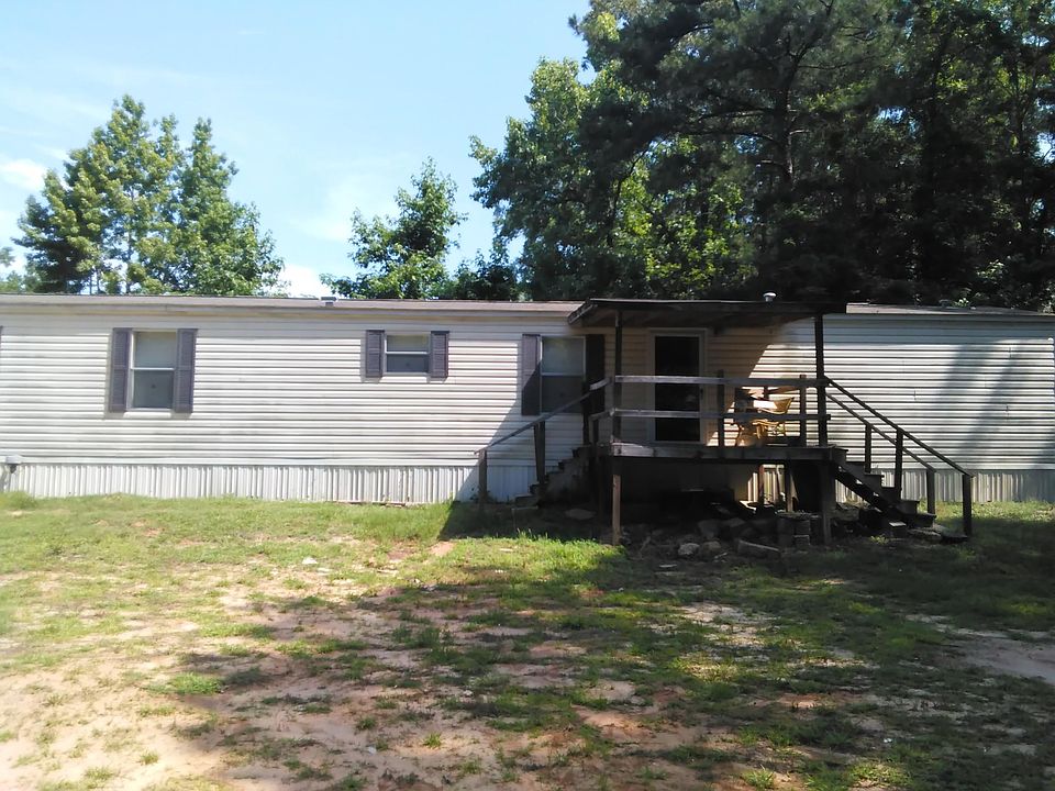 Outside view with parking & main road on left.