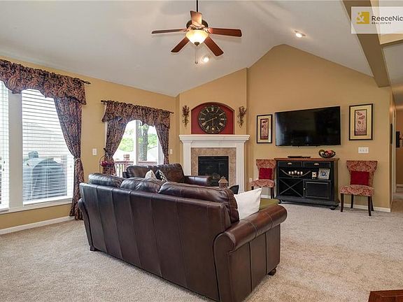 Spacious Great Room has dramatic vaulted ceiling and new carpet just installed!