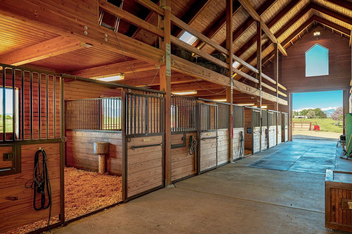 Seven stable master stalls with automatic waterers and pull out feeders and direct access to the paddock. Hay drops from above for easy feeding and room for 8 more stalls