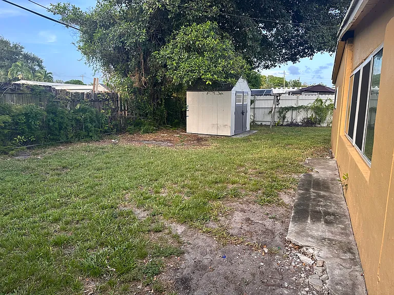 Spacious backyard with storage space