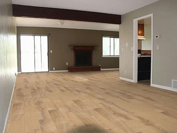Living and Dining area (rendering of new solid surface flooring to be installed prior to lease)