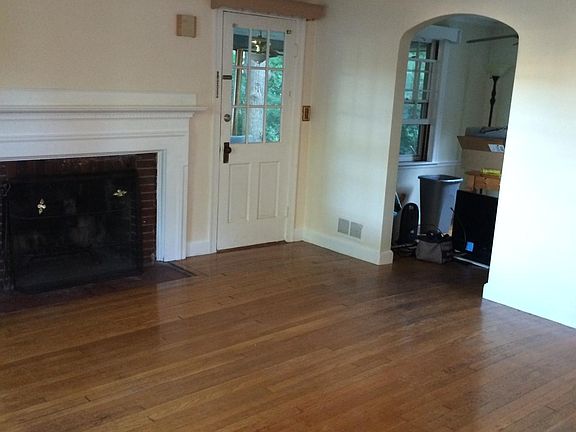 Living room empty, porch door/dining room